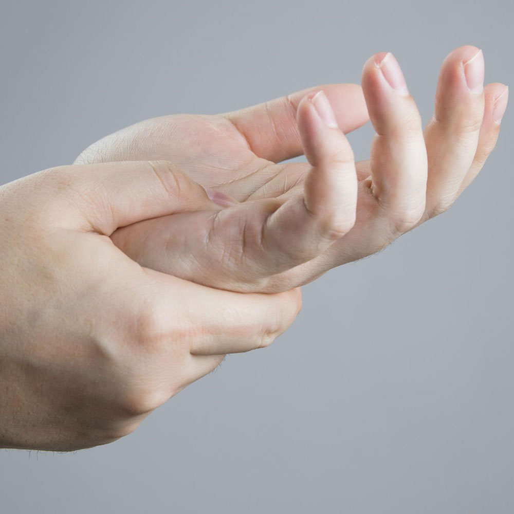 Symptoms may include numbness, tingling, swelling, stiffness, or weakness