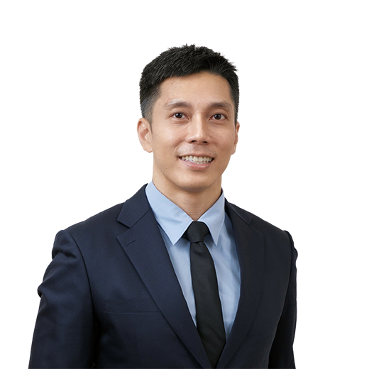 Professional man in a navy suit and blue shirt smiling at the camera (portrait).|